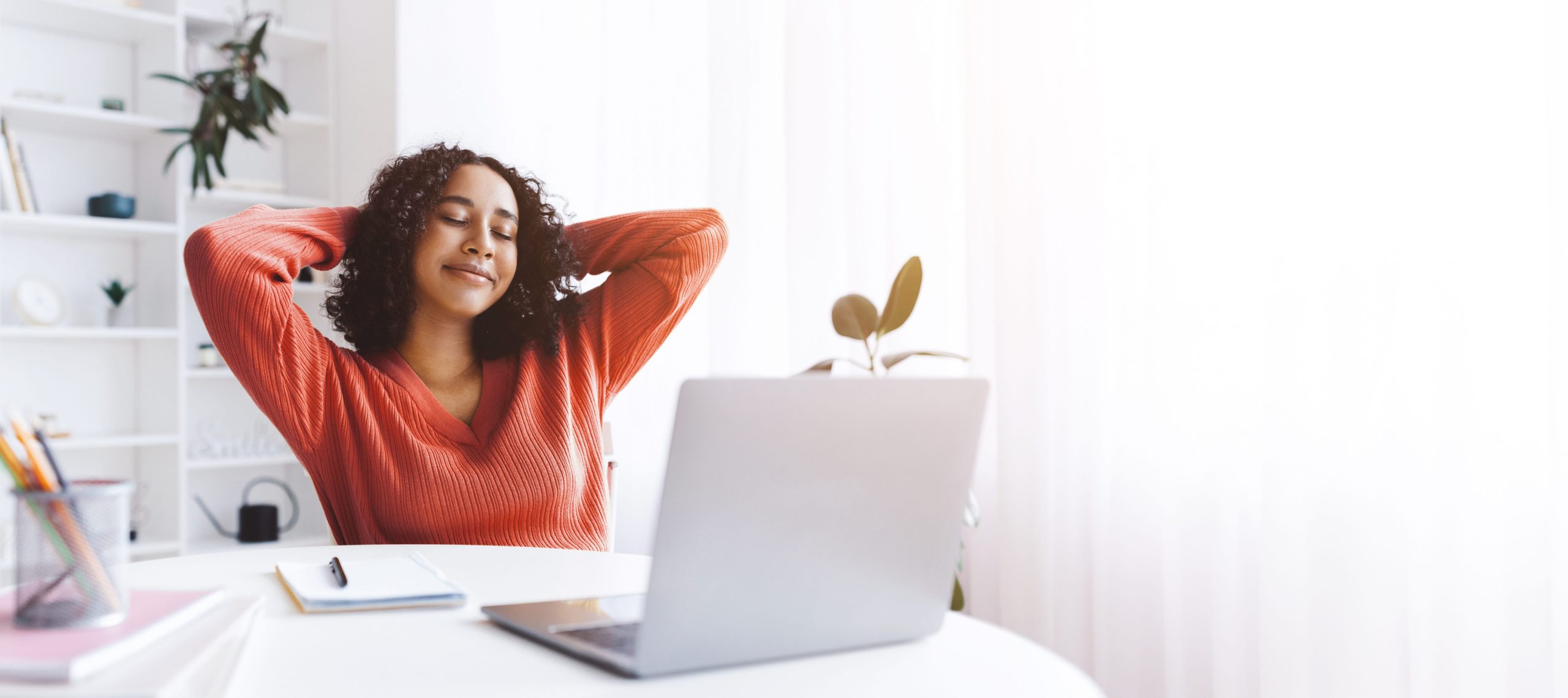 Woman Relaxing at Home While Working on Laptop During the Daytime